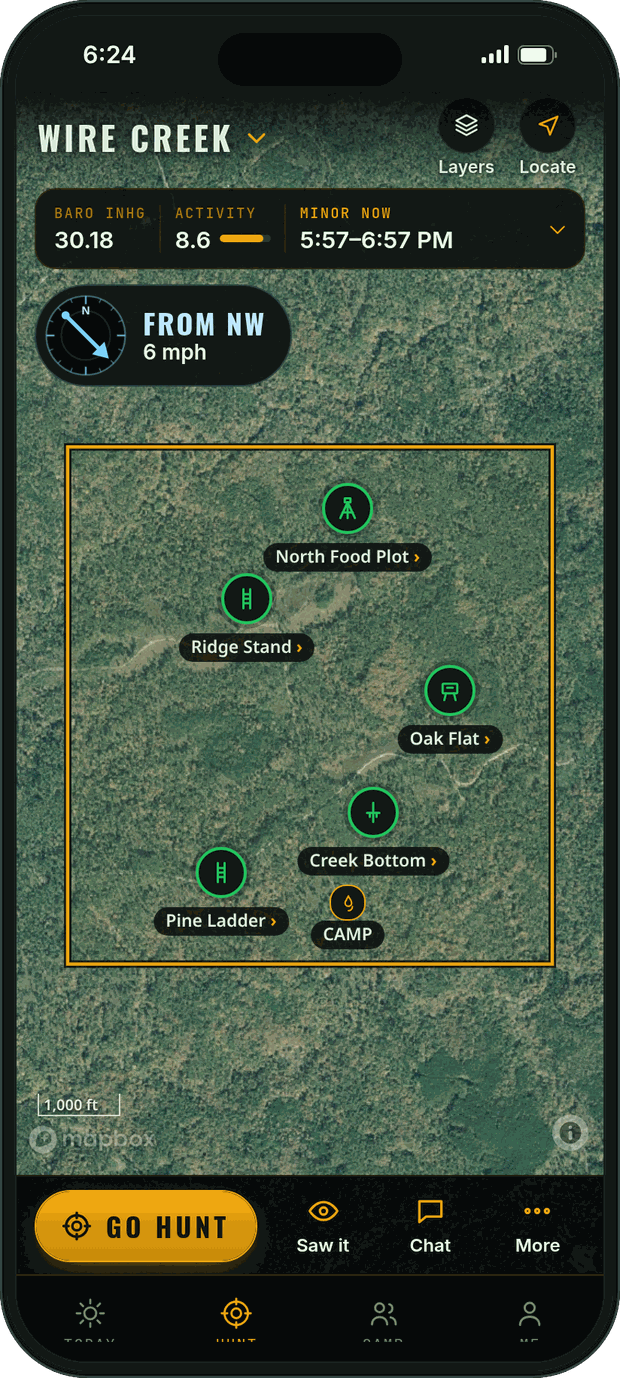 Hunt map on satellite: the Wire Creek property line with five stands over woods, wind from the northwest at 6 mph, a strip with pressure, activity and the minor period, and Go hunt, Saw it, Chat and More buttons